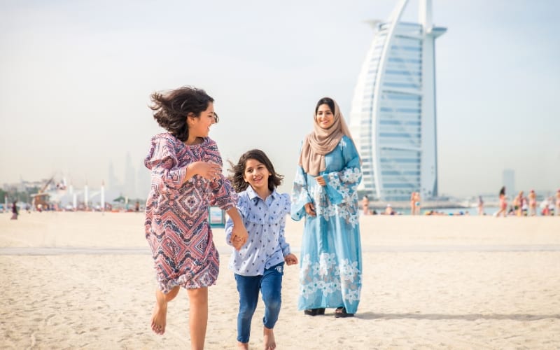 Family on beach in Dubai